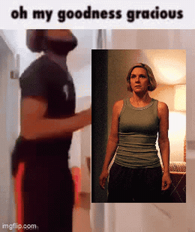 A Man And A Woman Are Standing Next To Each Other With The Words Oh My Goodness Gracious Below Them GIF