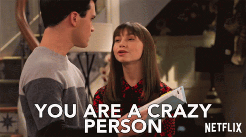 A Man And A Woman Are Standing Next To Each Other With The Words " You Are A Crazy Person " Above Them GIF