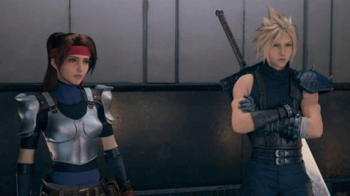 A Man And A Woman Are Standing Next To Each Other With Their Arms Crossed GIF