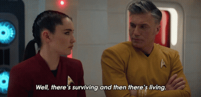 A Man And A Woman Are Talking And The Man Says Well There 'S Surviving And Then There 'S Living .. GIF