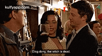 A Man And A Woman Are Talking In A Bar And The Man Says Ding Dong GIF