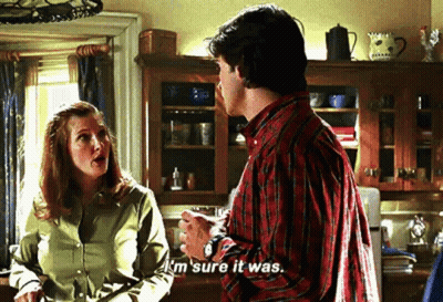 A Man And A Woman Are Talking In A Kitchen And The Man Is Saying `` I 'M Sure It Was . '' GIF