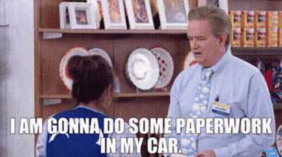 A Man And A Woman Are Talking In A Store . GIF