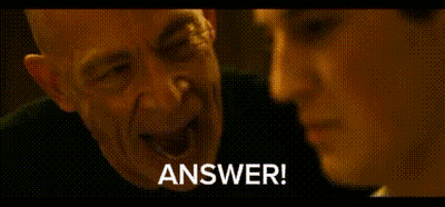 A Man And A Woman Are Talking To Each Other And The Man Is Saying `` Answer ! '' GIF