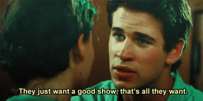 A Man And A Woman Are Talking To Each Other And The Man Is Saying They Just Want A Good Show . GIF