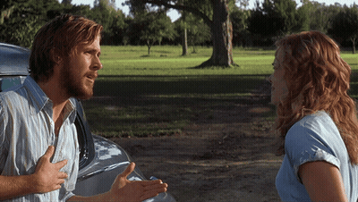 A Man And A Woman Are Talking To Each Other In A Field GIF