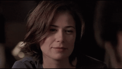 A Man And A Woman Are Touching Their Foreheads And Looking Into Each Other 'S Eyes GIF