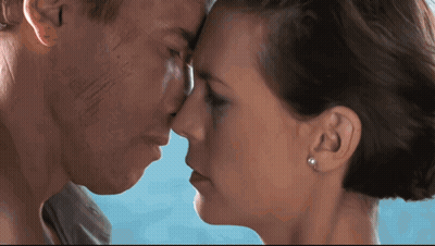 A Man And A Woman Are Touching Their Noses GIF