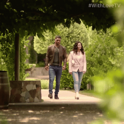 A Man And A Woman Are Walking Down A Path With The Hashtag #Withlovetv On The Bottom GIF
