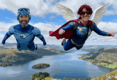 A Man And A Woman Flying Over A Body Of Water GIF