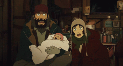 A Man And A Woman Holding A Baby In A Dark Room GIF