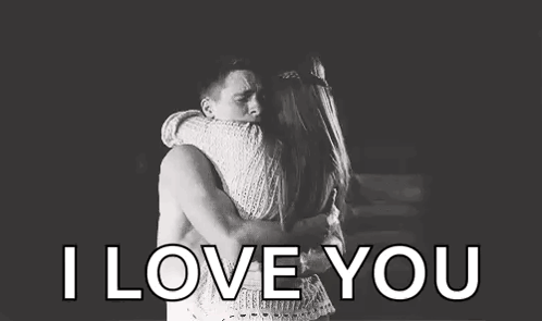 A Man And A Woman Hugging Each Other In A Black And White Photo With The Words `` I Love You '' . GIF