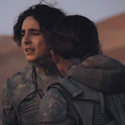 A Man And A Woman Hugging Each Other With The Man Holding The Woman 'S Head GIF