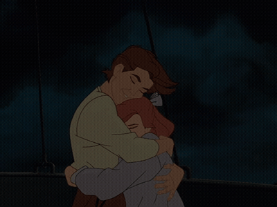 A Man And A Woman Hugging In The Dark GIF