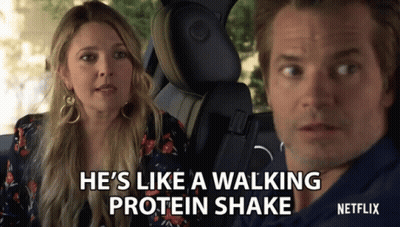 A Man And A Woman In A Car With The Words He 'S Like A Walking Protein Shake On The Screen GIF