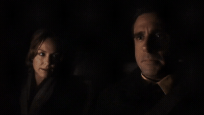 A Man And A Woman In A Dark Room With The Words I Feel Like It But I Am Not Going To Below Them GIF