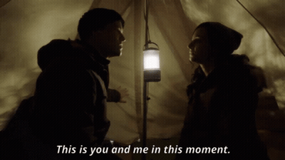 A Man And A Woman In A Tent With The Words This Is You And Me In This Moment Below Them GIF