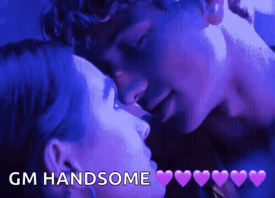 A Man And A Woman Kissing With The Words Gm Handsome Written Above Them GIF