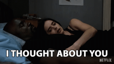 A Man And A Woman Laying In Bed With The Words " I Thought About You " On The Bottom GIF