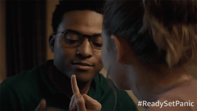 A Man And A Woman Looking At Each Other With #Readysetpanic Written On The Bottom GIF