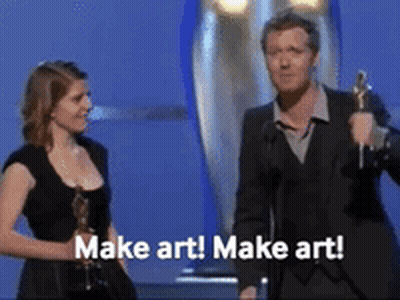 A Man And A Woman On A Stage With The Words Make Art Written On The Bottom GIF