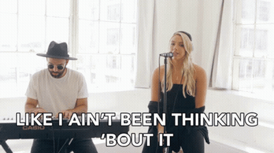 A Man And A Woman Singing In Front Of A Keyboard That Says Casio GIF