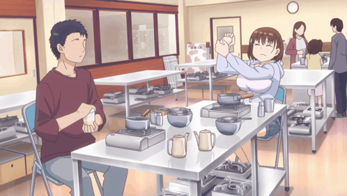 A Man And A Woman Sit At A Table With Pots And Pans On It GIF