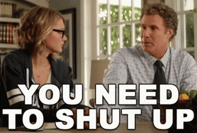 A Man And A Woman Sitting At A Table With The Words You Need To Shut Up GIF