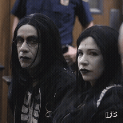 A Man And A Woman Sitting Next To Each Other With The Letters Ifc On The Bottom Right GIF