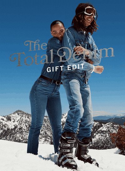 A Man And A Woman Standing In The Snow With The Words The Total Denim Gift Edit GIF