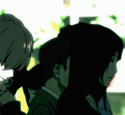 A Man And A Woman Standing Next To Each Other In A Dark Room GIF