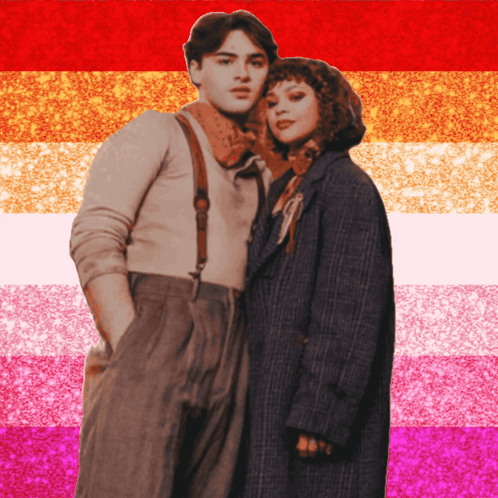 A Man And A Woman Standing Next To Each Other In Front Of A Pink And Orange Striped Background GIF