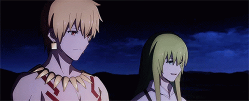 A Man And A Woman Standing Next To Each Other GIF