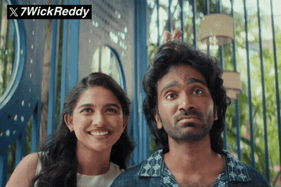 A Man And A Woman Standing Next To Each Other With 7Wick Reddy Written On The Top GIF