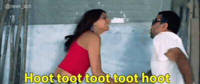 A Man And A Woman Standing Next To Each Other With A Caption That Says Hoot Toot Toot Toot Toot GIF