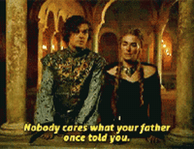 A Man And A Woman Standing Next To Each Other With Nobody Cares What Your Father Once Told You Written On The Bottom GIF