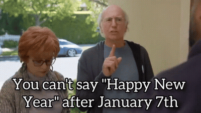 A Man And A Woman Standing Next To Each Other With The Caption " You Can 'T Say Happy New Year " GIF