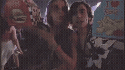 A Man And A Woman Standing Next To Each Other With The Words " Got It " On The Bottom Right GIF