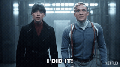 A Man And A Woman Standing Next To Each Other With The Words I Did It Written On The Screen GIF