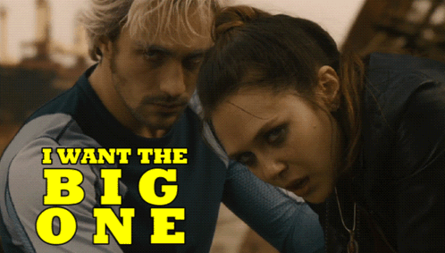 A Man And A Woman Standing Next To Each Other With The Words " I Want The Big One " On The Bottom GIF