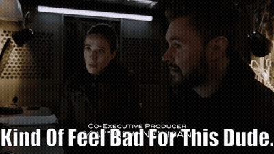 A Man And A Woman Standing Next To Each Other With The Words Kind Of Feel Bad For This Dude GIF