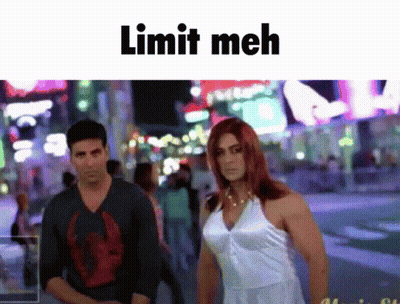 A Man And A Woman Standing Next To Each Other With The Words Limit Meh Written Above Them GIF