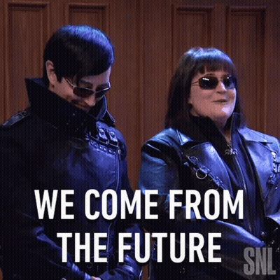 A Man And A Woman Standing Next To Each Other With The Words We Come From The Future GIF