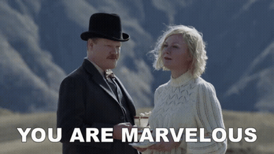 A Man And A Woman Standing Next To Each Other With The Words " You Are Marvelous " Below Them GIF
