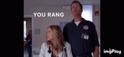 A Man And A Woman Standing Next To Each Other With The Words " You Rang " On The Bottom GIF