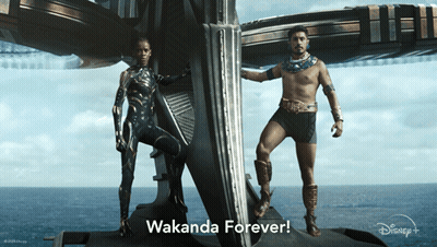 A Man And A Woman Standing Next To Each Other With Wakanda Forever Written In The Corner GIF