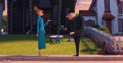 A Man And A Woman Standing On The Sidewalk In Front Of A House GIF