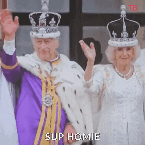 A Man And A Woman Wearing Crowns And Robes Are Waving . GIF