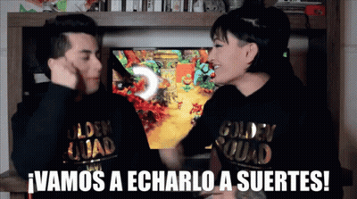 A Man And A Woman Wearing Golden Squad Sweatshirts Are Playing A Video Game GIF