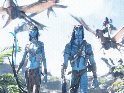 A Man And A Woman With Blue Faces Are Standing In A Field GIF